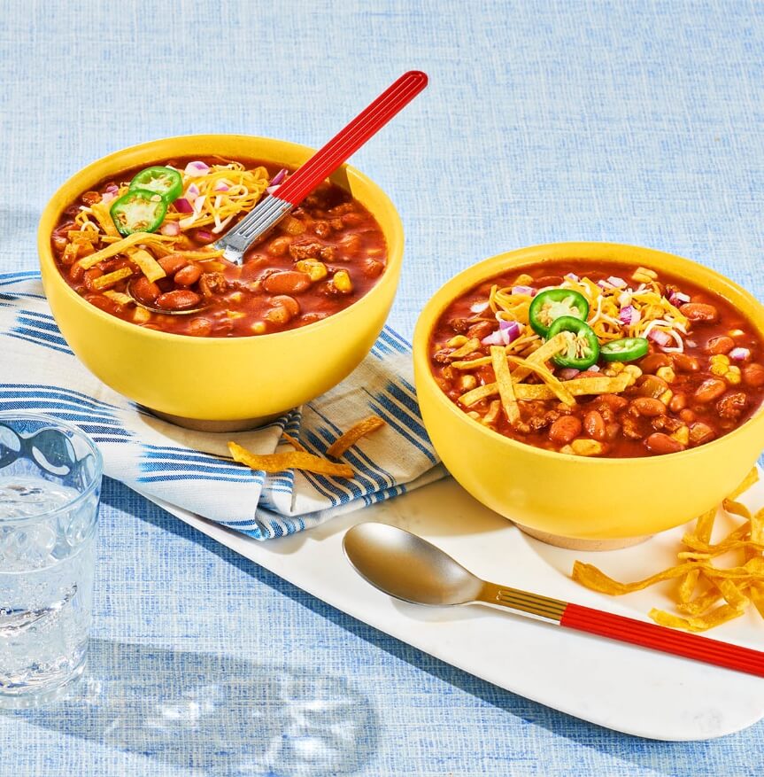 Instant Pot or slow cooker chili with beans topped with cheese and jalapeños.