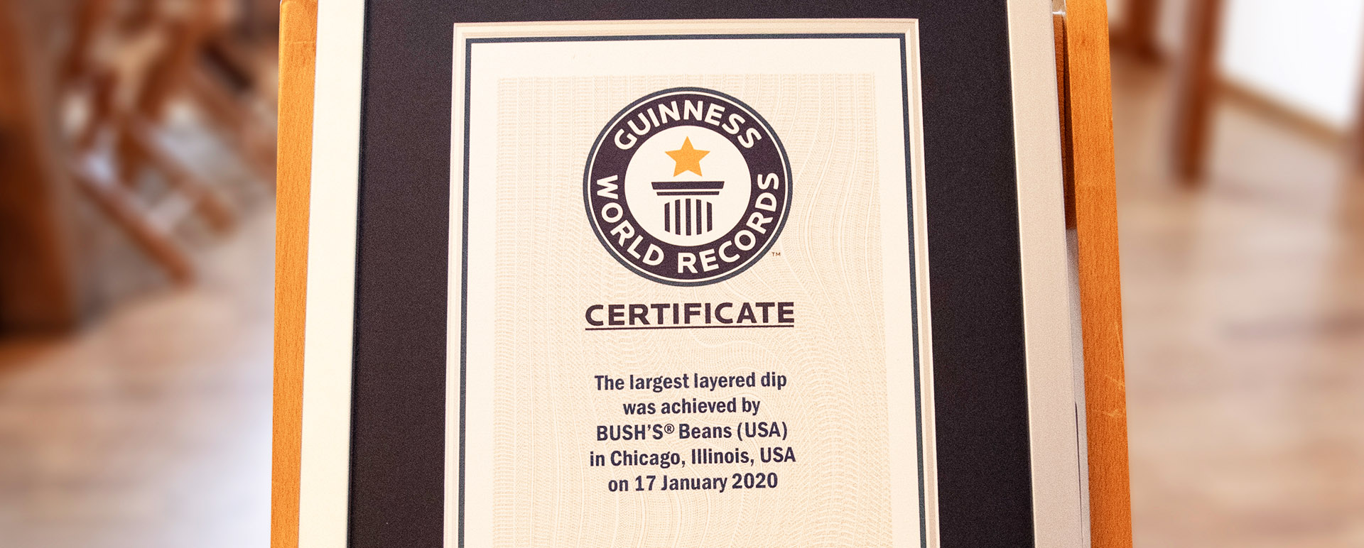 A framed Guinness World Records certificate for the world’s largest layered dip award to Bush’s Beans