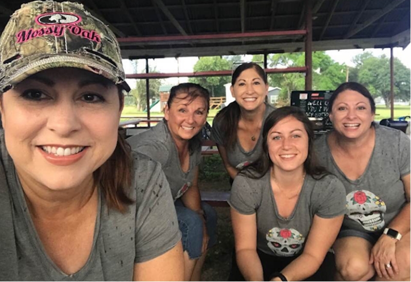 Dianne Lewis and her crew of chili-loving ladies smiling for the camera